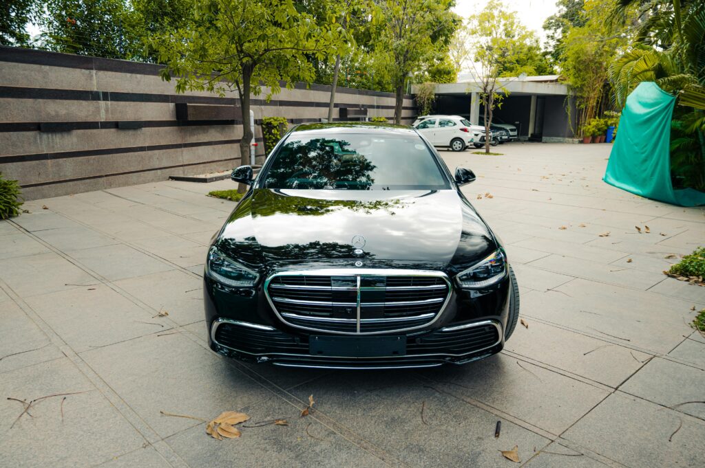 Sleek black luxury car parked outdoors, showcasing modern automotive design and elegance.