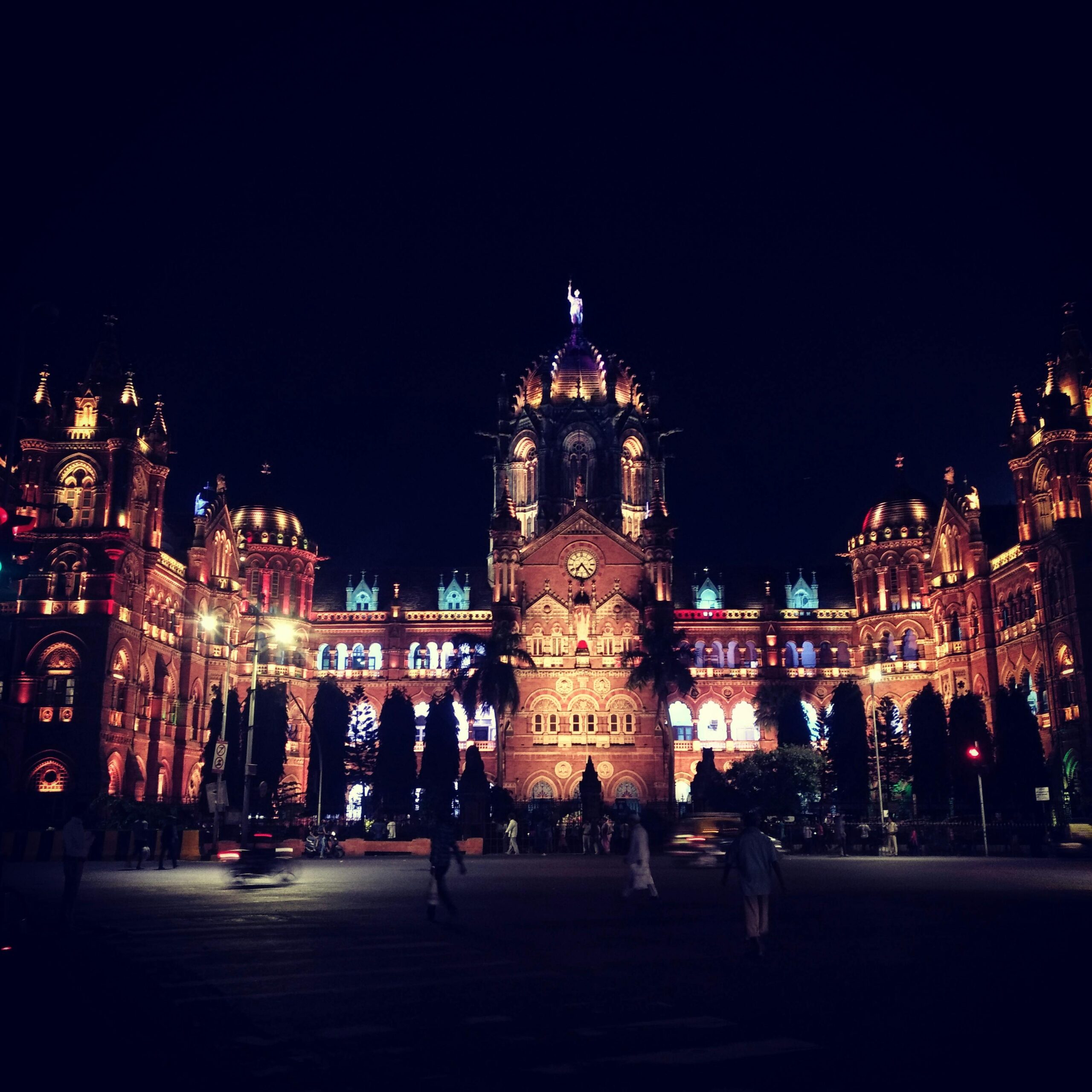 Iconic Chhatrapati Shivaji Terminus in Mumbai, beautifully illuminated at night, showcasing stunning architecture.